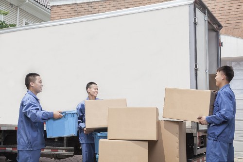 Packed boxes and bedroom items prepared for a student move in Edgware