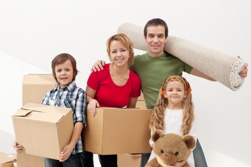 Packed boxes and furniture ready for loading into a removal truck